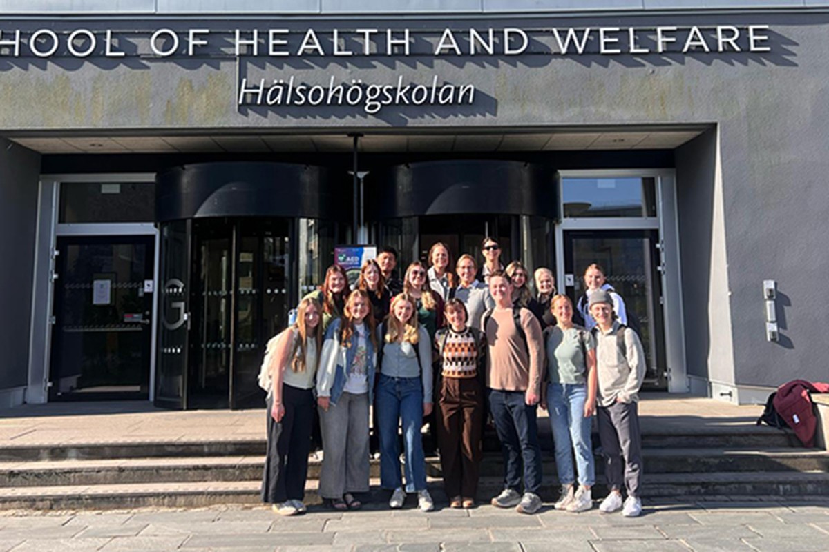 A group of students outside a school in Sweden.